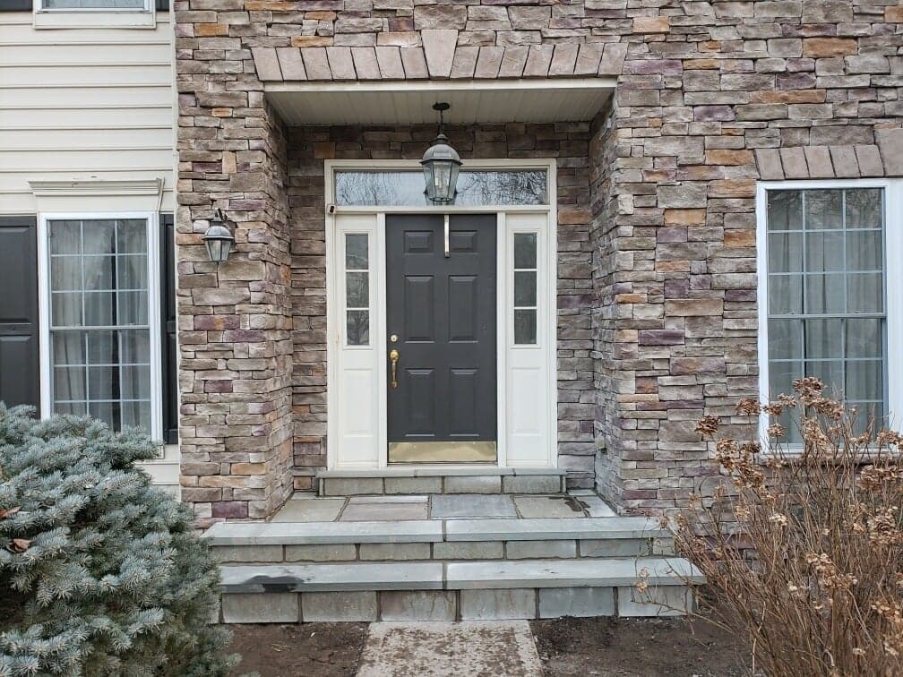 front steps to doorway with off-grey stone