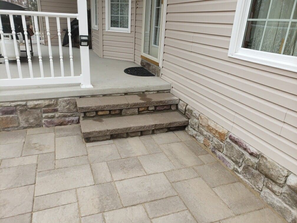 little steps from patio up to porch