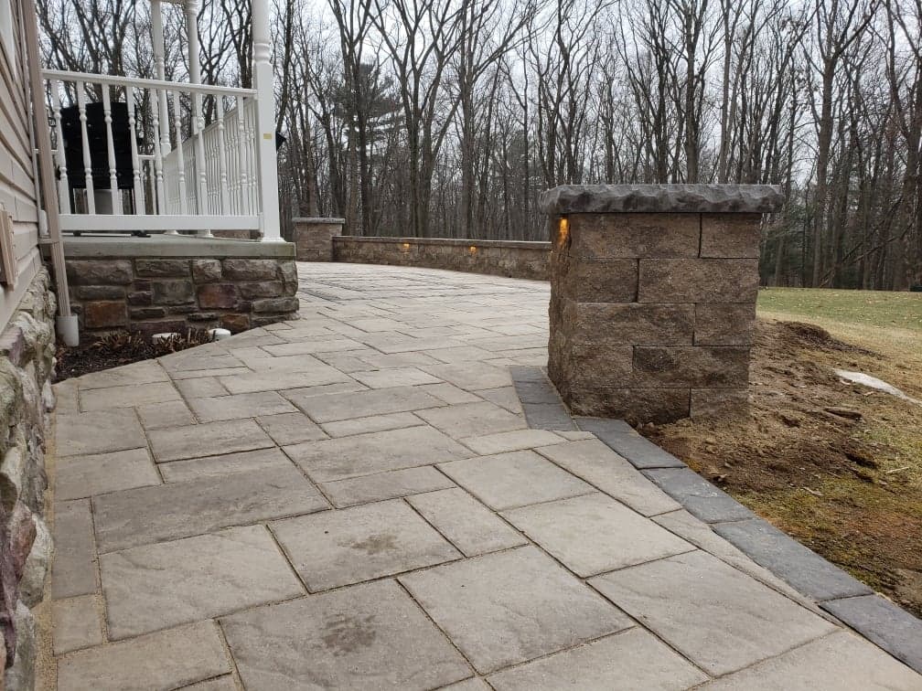 completed patio with with wall and lighting