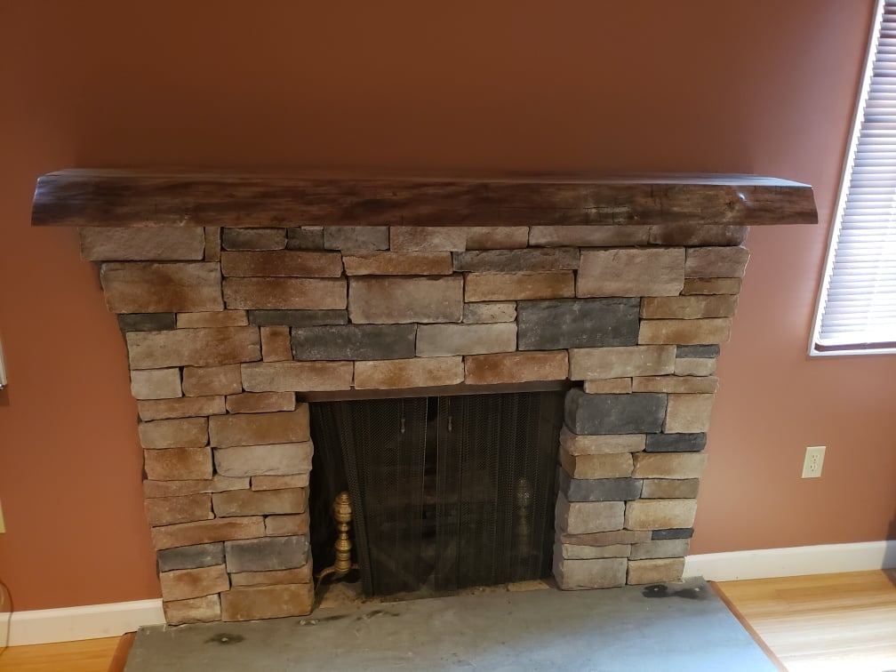 indoor stone brick variety forming fireplace