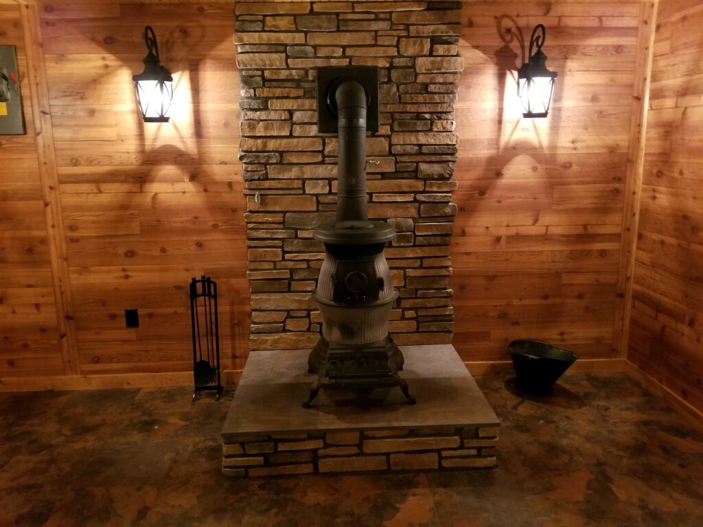 wood stove on beautiful stone floor and wall