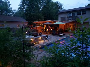 nighttime patio party by the pool