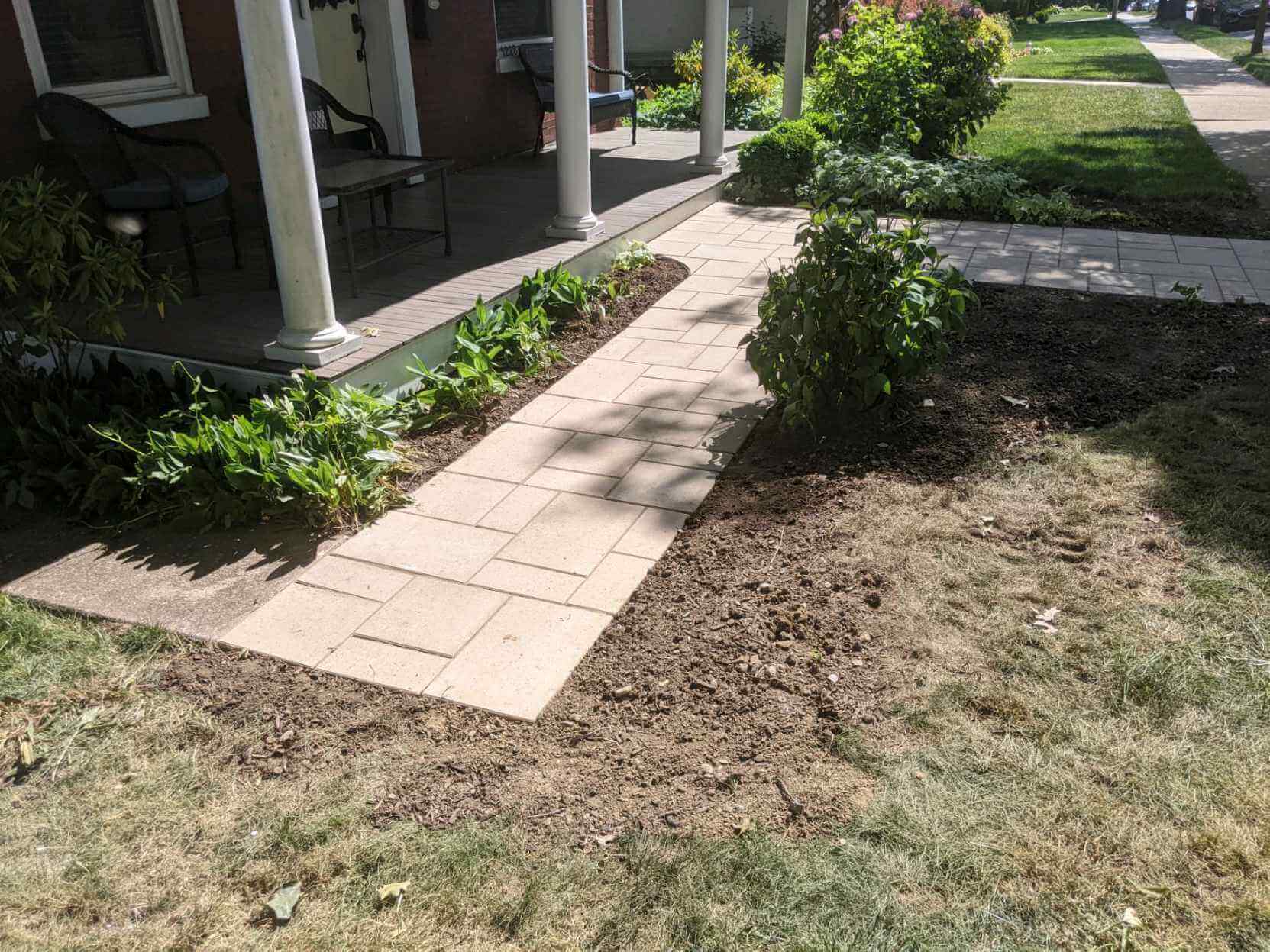 elegant stone path connecting the front porch with other walkways