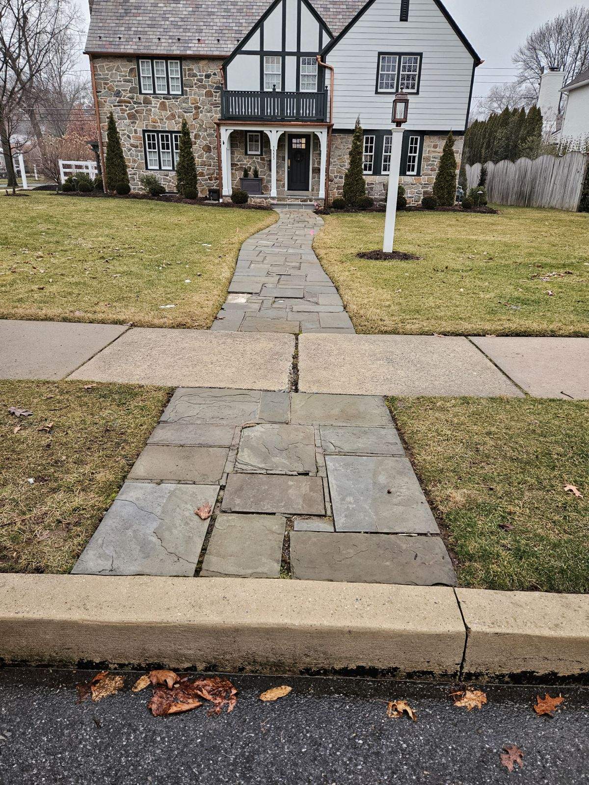 Before: stone walkway with varying sizes that's become very worn and irregular