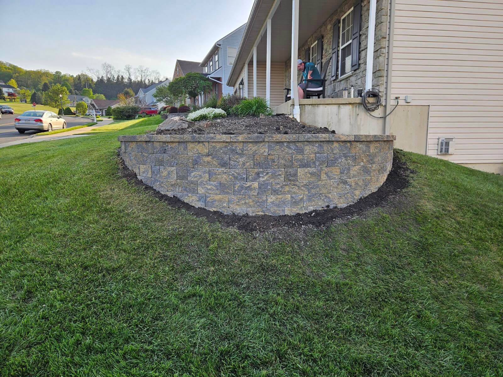 newly rebuilt retaining wall at the corner of a porch