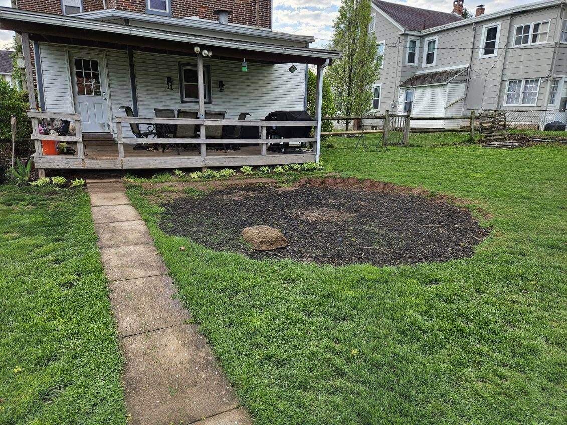 old sidewalk path and mulch pit before renovation